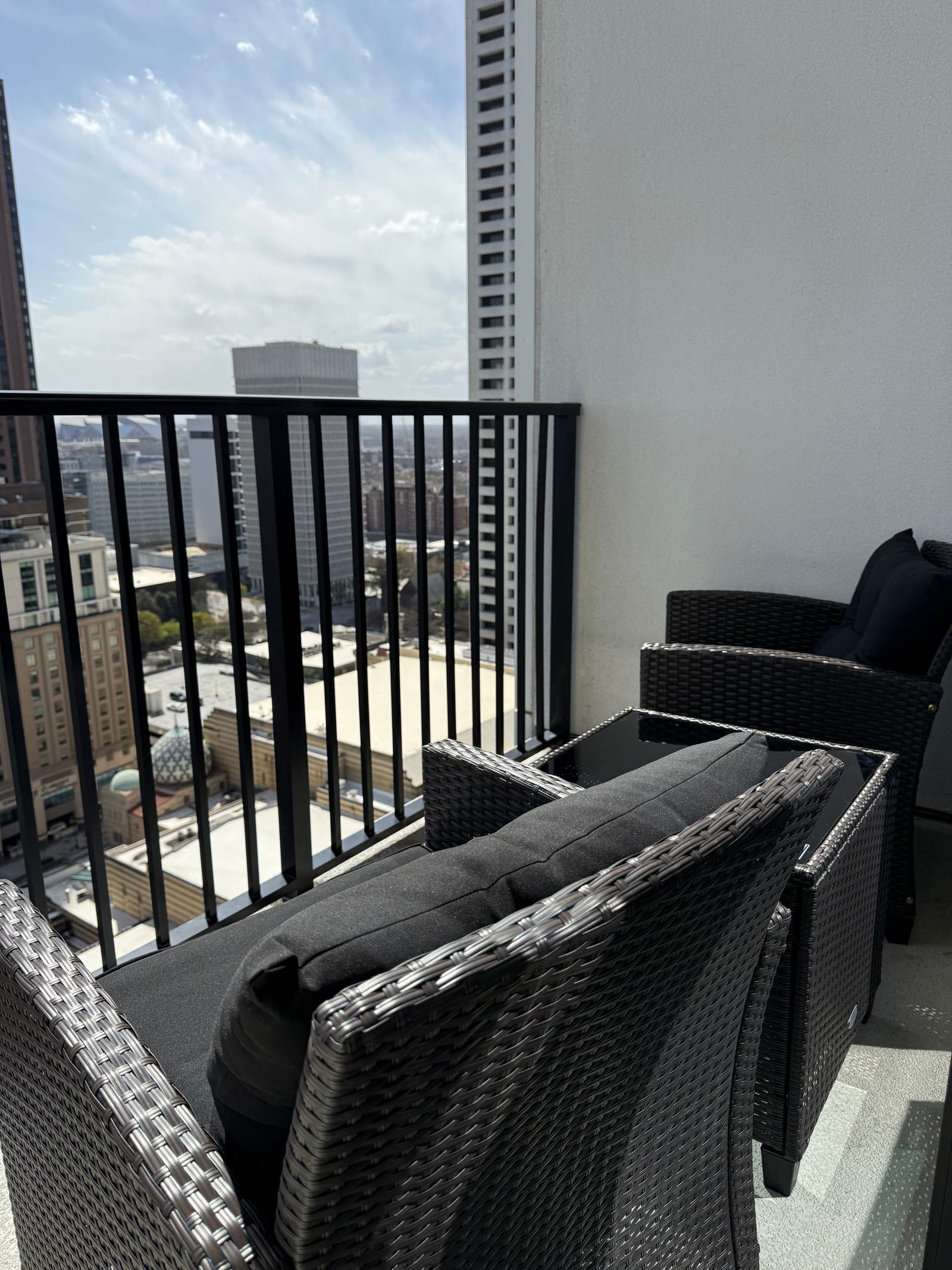 Private balcony seating overlooking downtown Atlanta