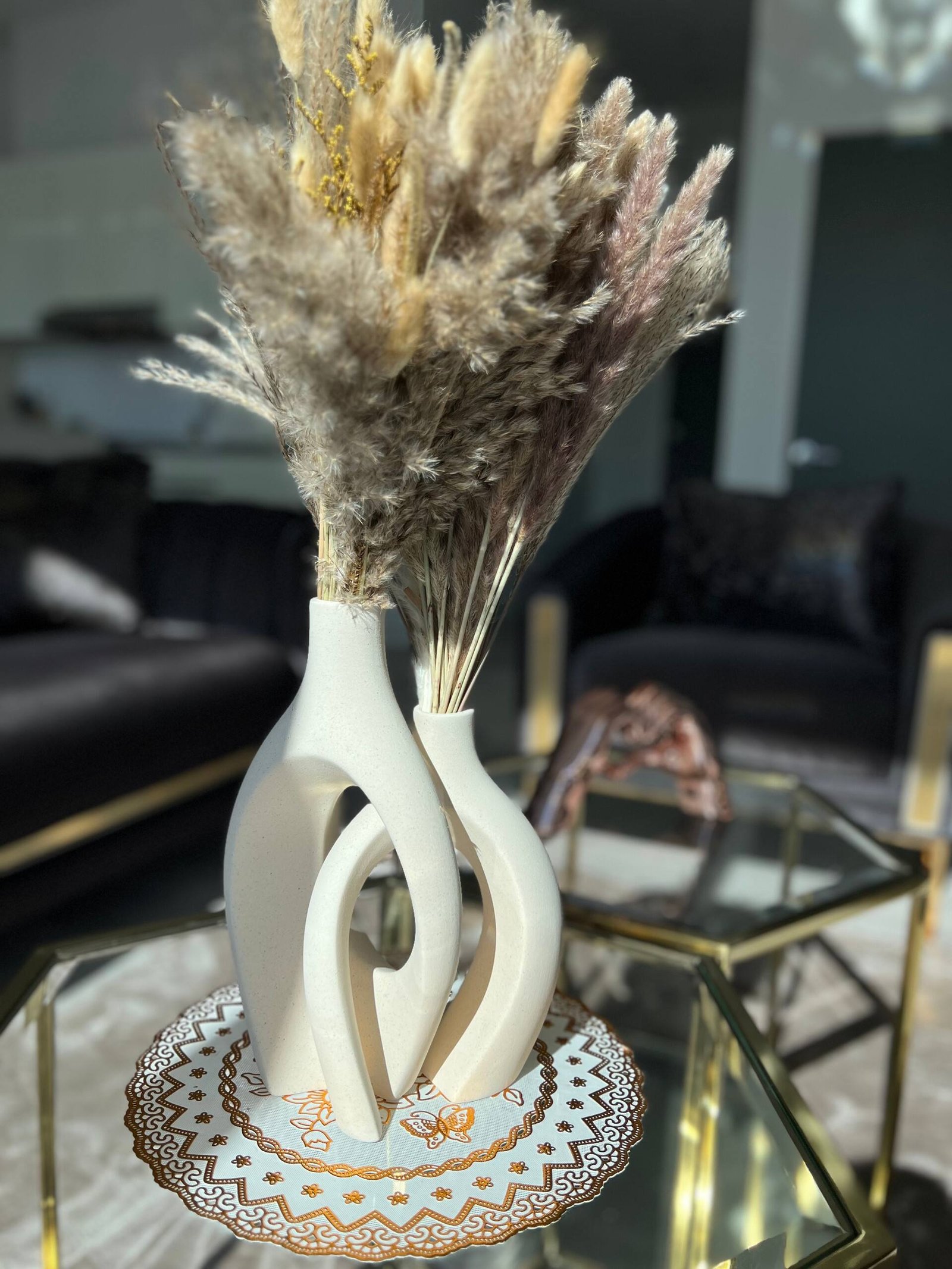 Styled glass side table with pampas arrangement